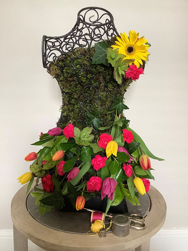 Alison Harvey's Gold Award Winning flower arrangement in the Don't judge a book ....  class of the Royal Cheshire County 'Virtual' Show 2021