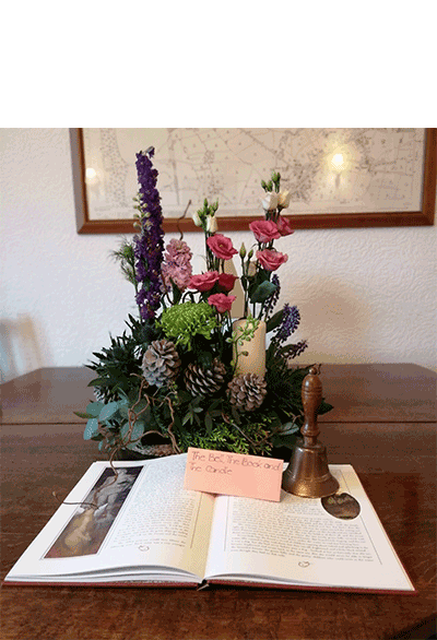 Elizabeth Dakin's flower arrangement in the Don't judge a book ....  class of the Royal Cheshire County 'Virtual' Show 2021