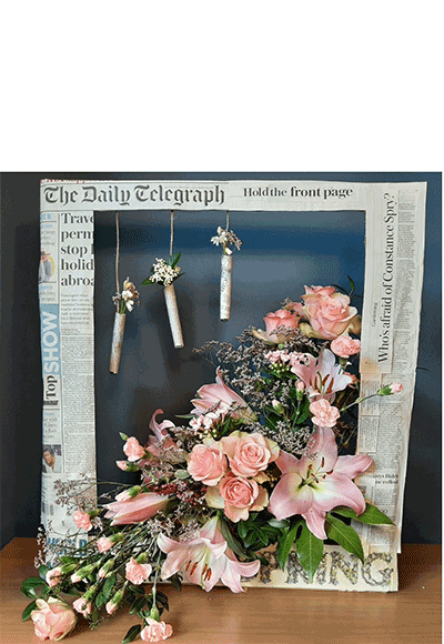 Julie McGuire's Bronze Award Winning flower arrangement in the Hold the front page class of the Royal Cheshire County 'Virtual' Show 2021