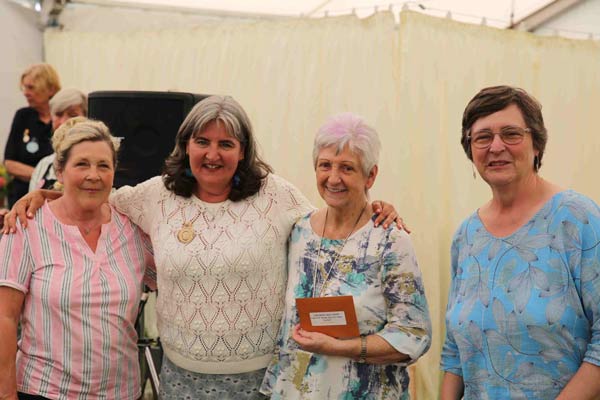 Flower Clubs of Cheshire class award winners with NAFAS National Chairman Nicky Wylie at the 2024 Royal Cheshire Show 